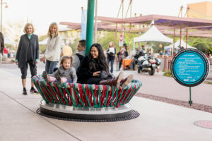 los trompos exhibit with families interacting