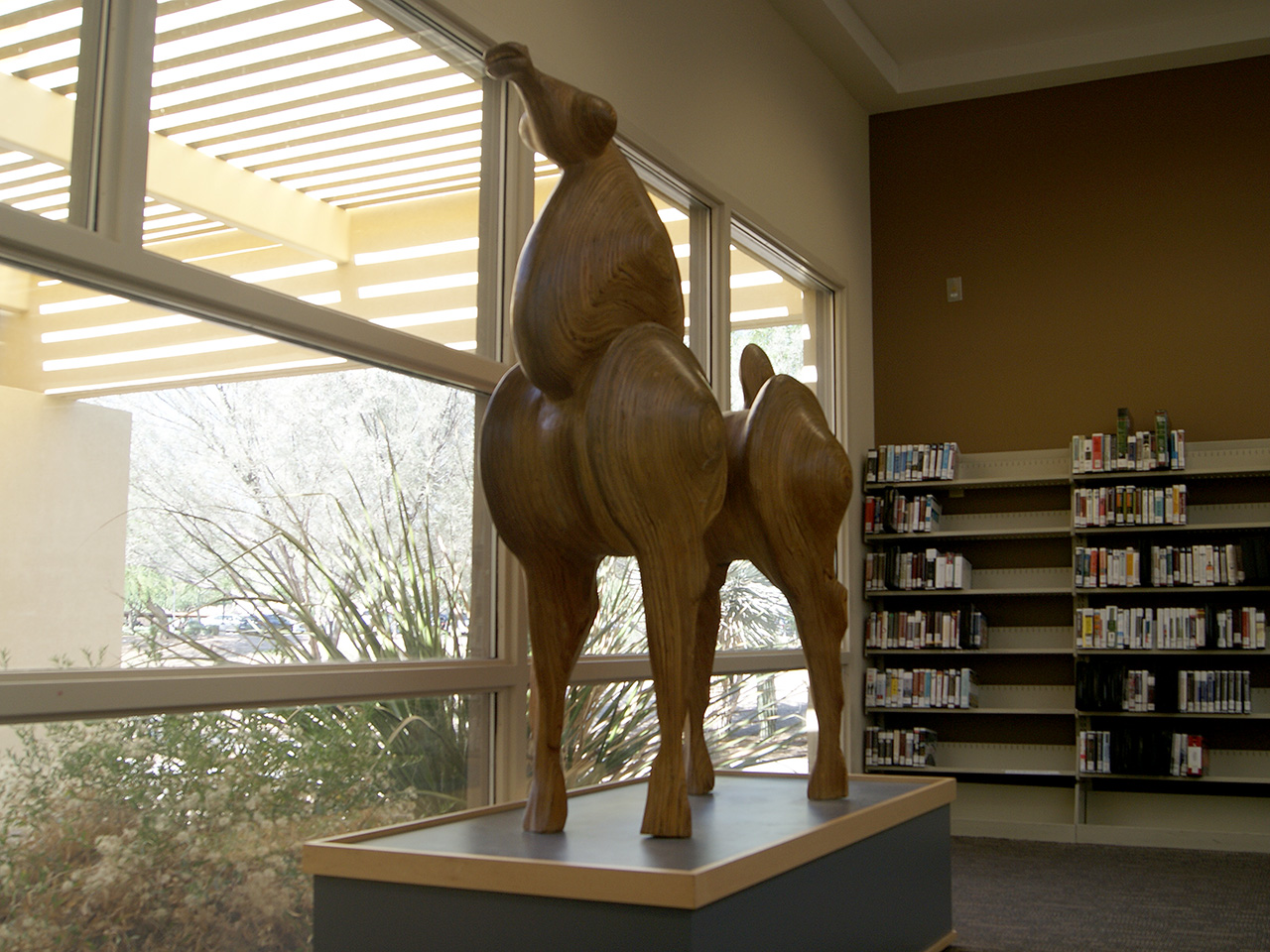 wooden horse sculpture in library